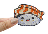 Hand einer Frau hält den Kawaii Sushi Nigiri Patch