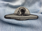 Astronauten-Patch auf blauer Jeans