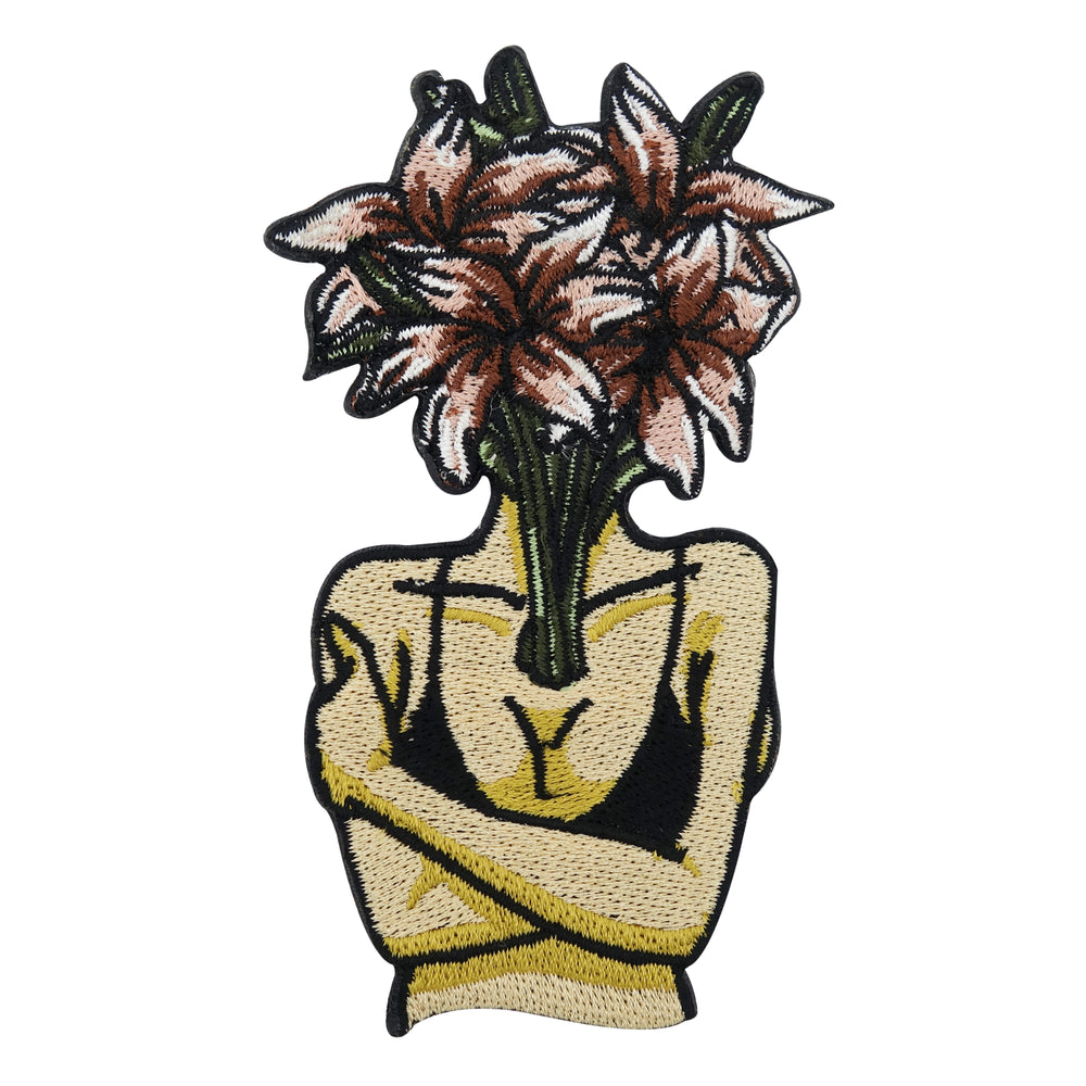 Frauenkörper mit braunem Blumenkopf Patch