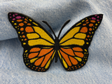 Schmetterling Patch auf blauer Jeans