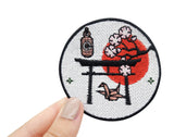 Japanische Kultur Patch gehalten von einer Frauenhand