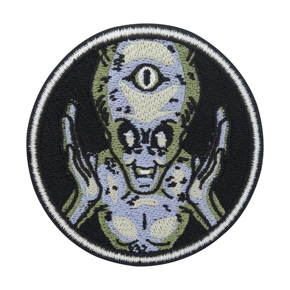 Schwarzer Alien mit drei Augen Patch