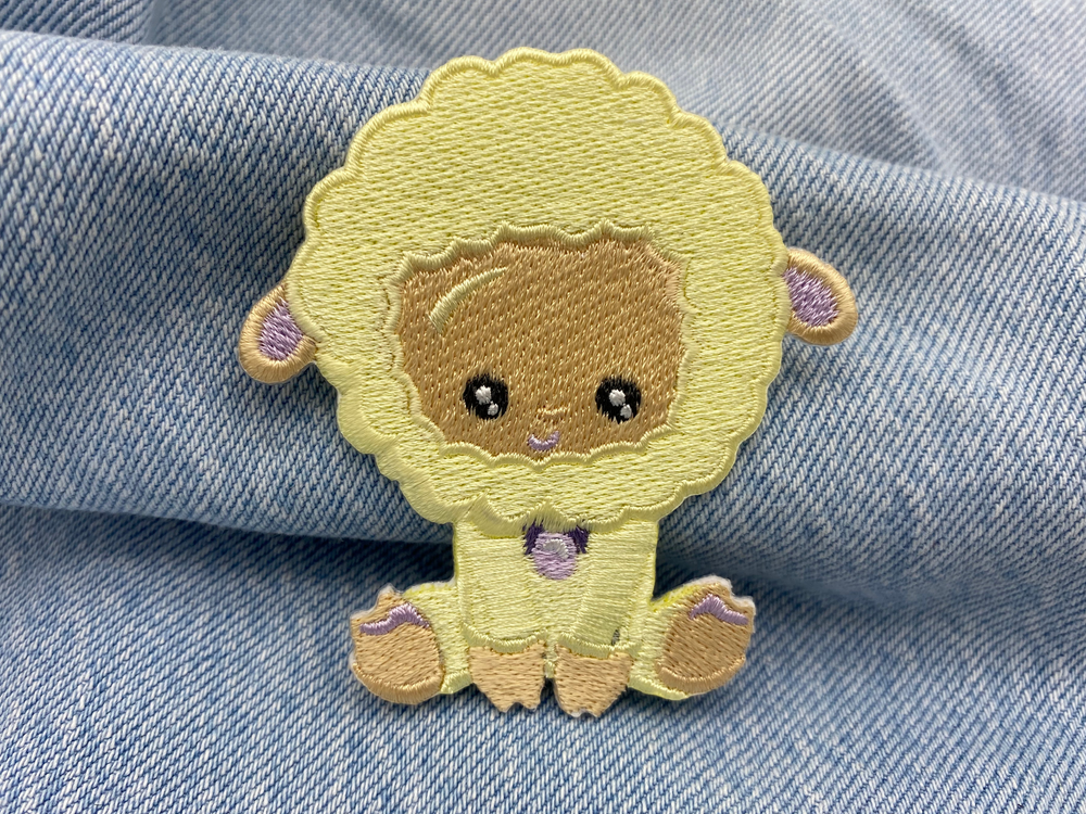 Baby Schaf Patch auf blauer Jeans