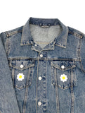Gänseblumen Patches auf Jeansjacke aufgebügelt
