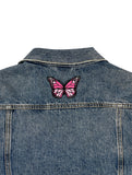 Schmetterling Patch auf Rückseite einer Jeansjacke aufgebügelt