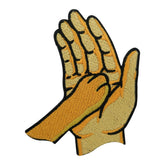 Beiges Hundepfote auf Hand Patch
