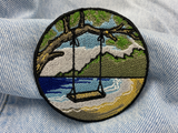Strand Schaukel Patch auf blauer Jeans