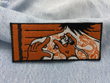 Tätowierer Patch auf blauer Jeans