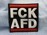 FCK AFD Patch auf blauer Jeans