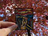 Katzen Patch gehalten von einer Frauenhand mit Herbstbaum im Hintergrund