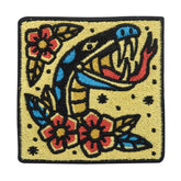 Gelber Schlange mit Blumen Patch