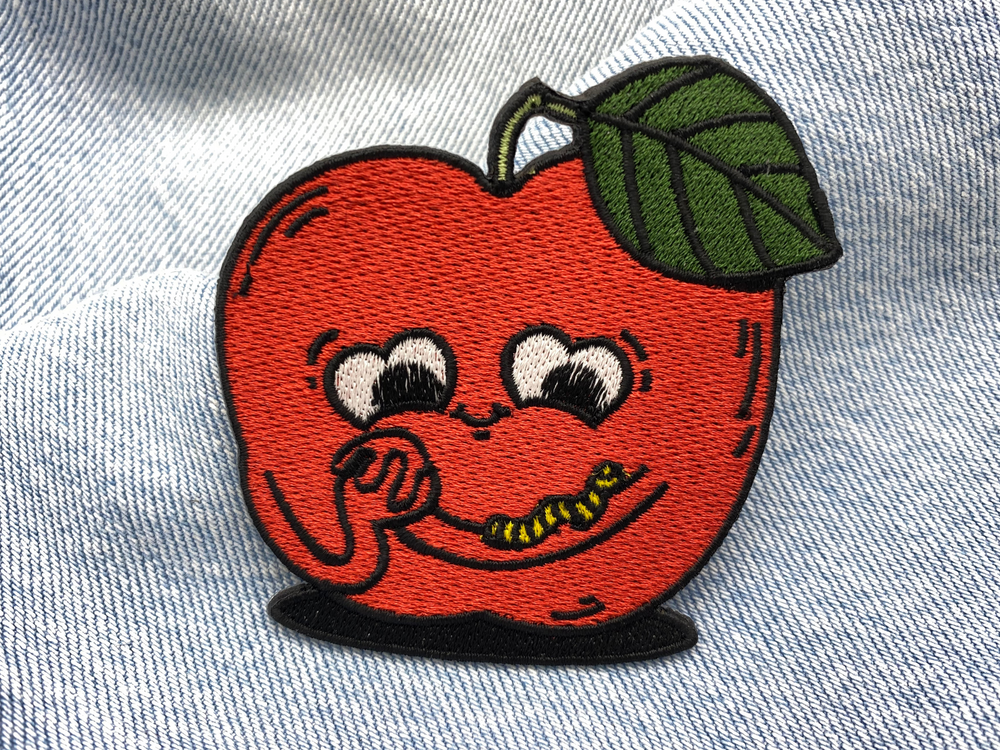 Apfel Patch auf blauer Jeans