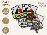 Vorder- und Rückseite des Patches, mit Bügelfolie. „Finally Home“ Logo und Nutzungsoptionen: Aufbügeln, Aufnähen, Aufkleben mit Textilkleber
