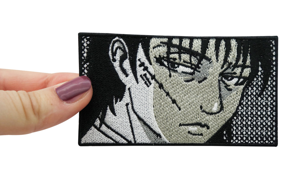 Frauenhand hält den Anime Bad Boy Patch