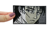 Frauenhand hält den Anime Bad Boy Patch