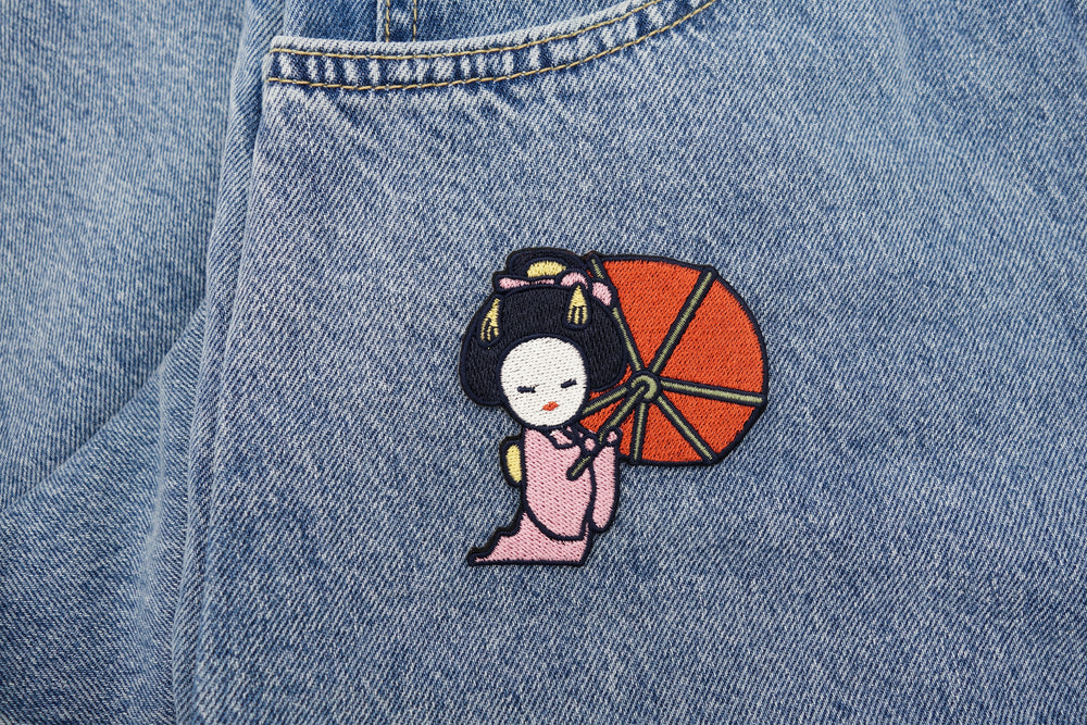 Japanische Frau Patch auf blauer Jeans