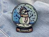 Schneemann Patch auf hellblauer Jeans