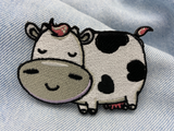 Kuh Patch auf hellblauer Jeans