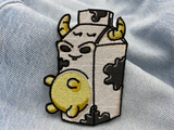 Milch Kuh Patch auf hellblauer Jeans