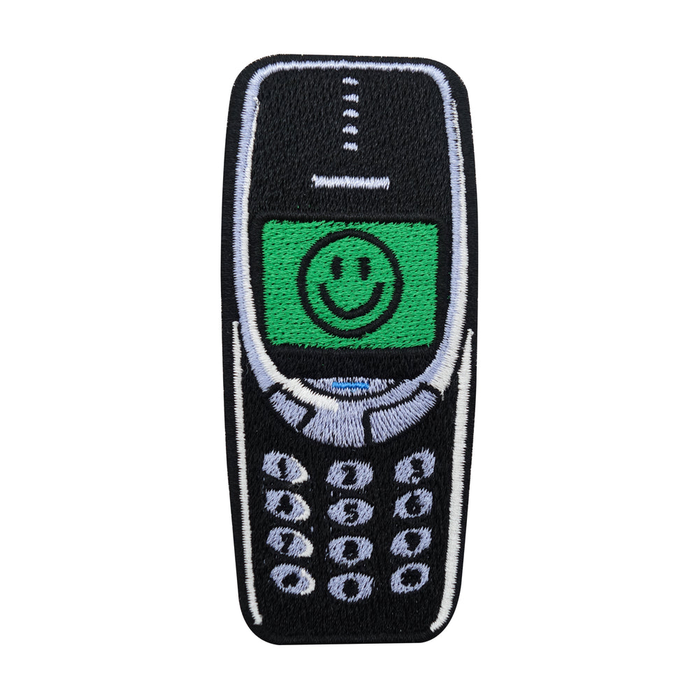 Schwarzer Retro Handy mit Smiley Patch