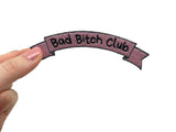 Frauenhand hält den Bad Bitch Club Banner Patch