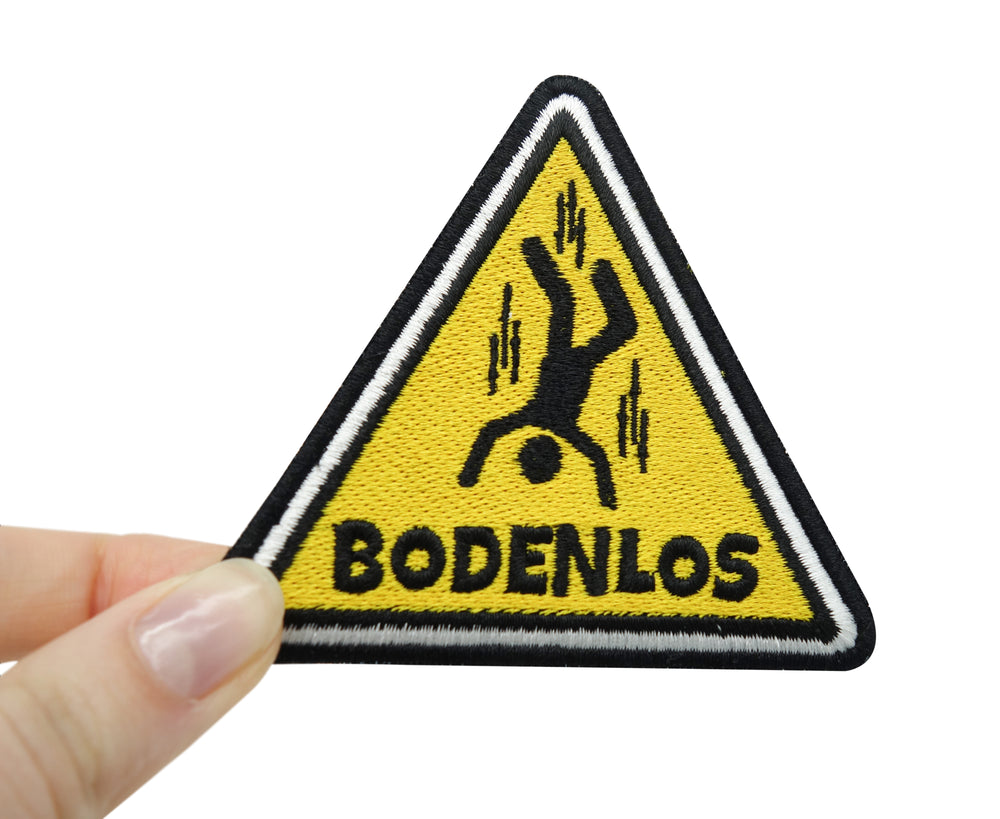 Bodenlos Klettpatch gehalten von einer Frauenhand