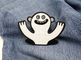 Lustiges Monster Patch auf blauer Jeans