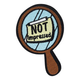 Brauner Handspiegel mit Not Impressed Notiz Patch