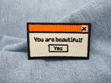 You are beautiful Patch auf hellblauer Jeans