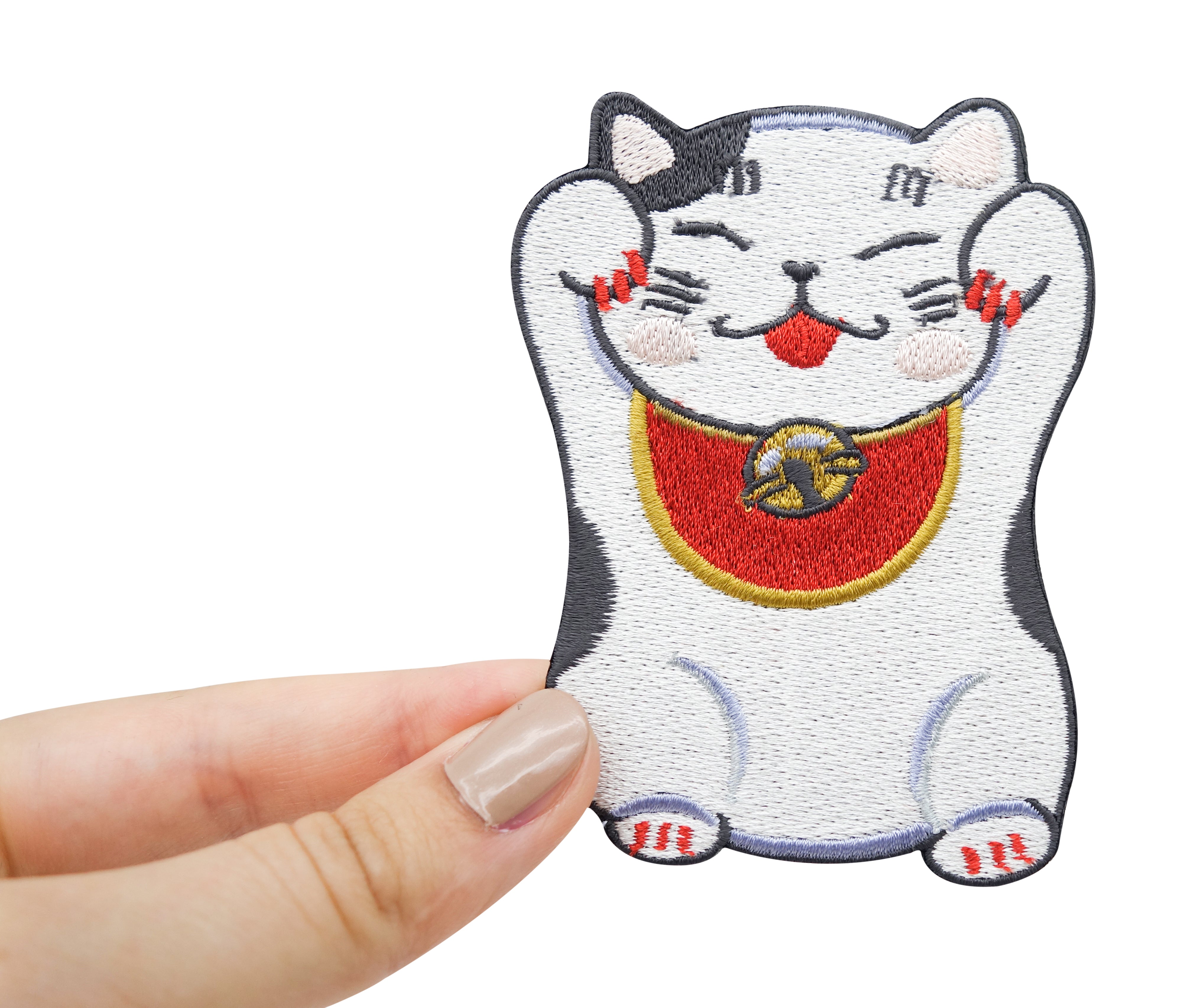 Hand hält Schwarzen Chinesische Glückskatze Patch