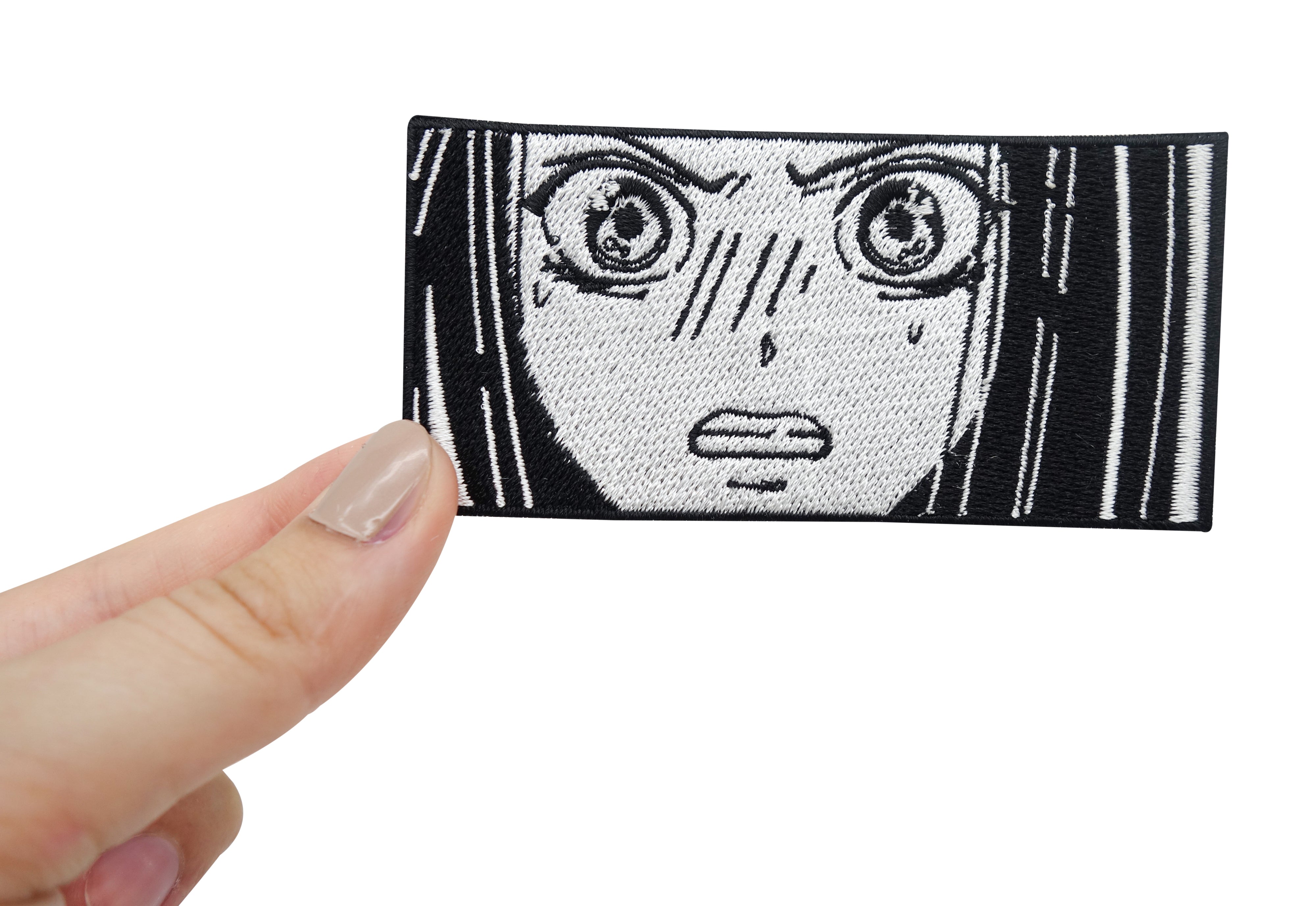 Frauenhand hält das Wütende Anime Mädchen Patch
