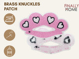 Vorder- und Rückansicht des rosa Schlagring-Patches mit Bügelfolie und "Finally Home" Logo