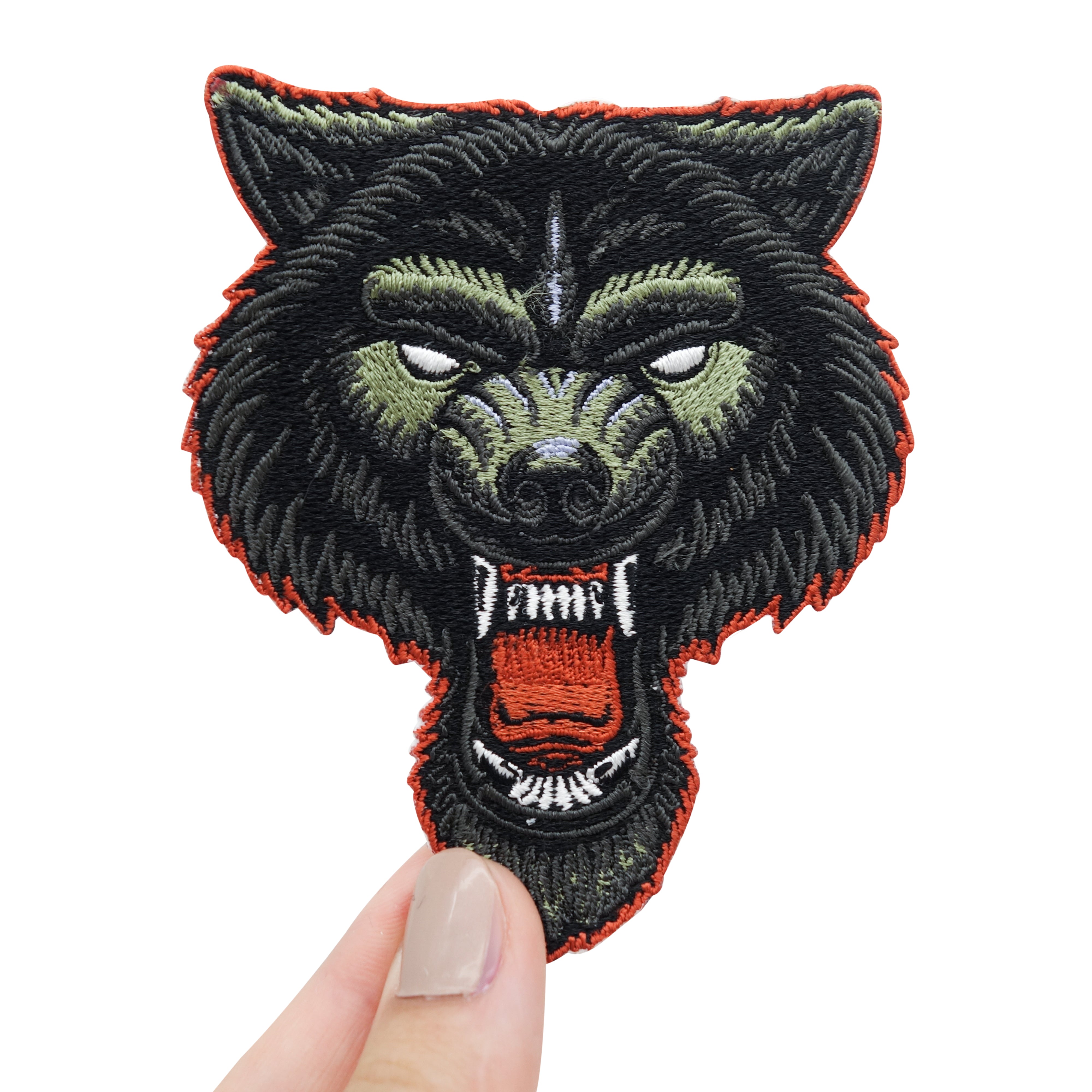 Wolf Patch in Frauenhand