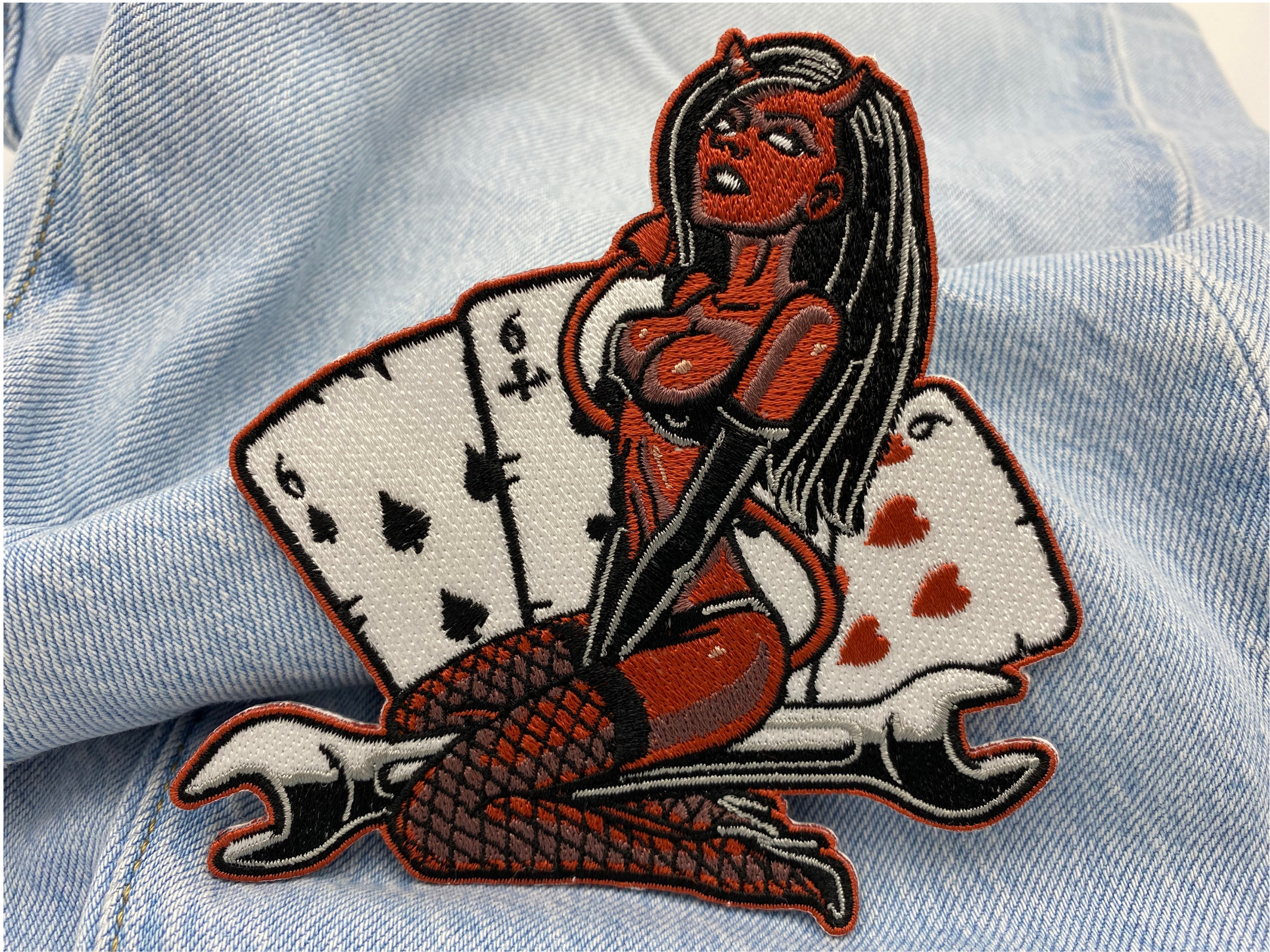 Sexy Teufel Patch auf einer blauen Jeans