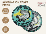Vorder- und Rückansicht des Patches mit Bügelfolie. Icons zeigen Bügeleisen, Nadel & Faden sowie Textilkleber.
