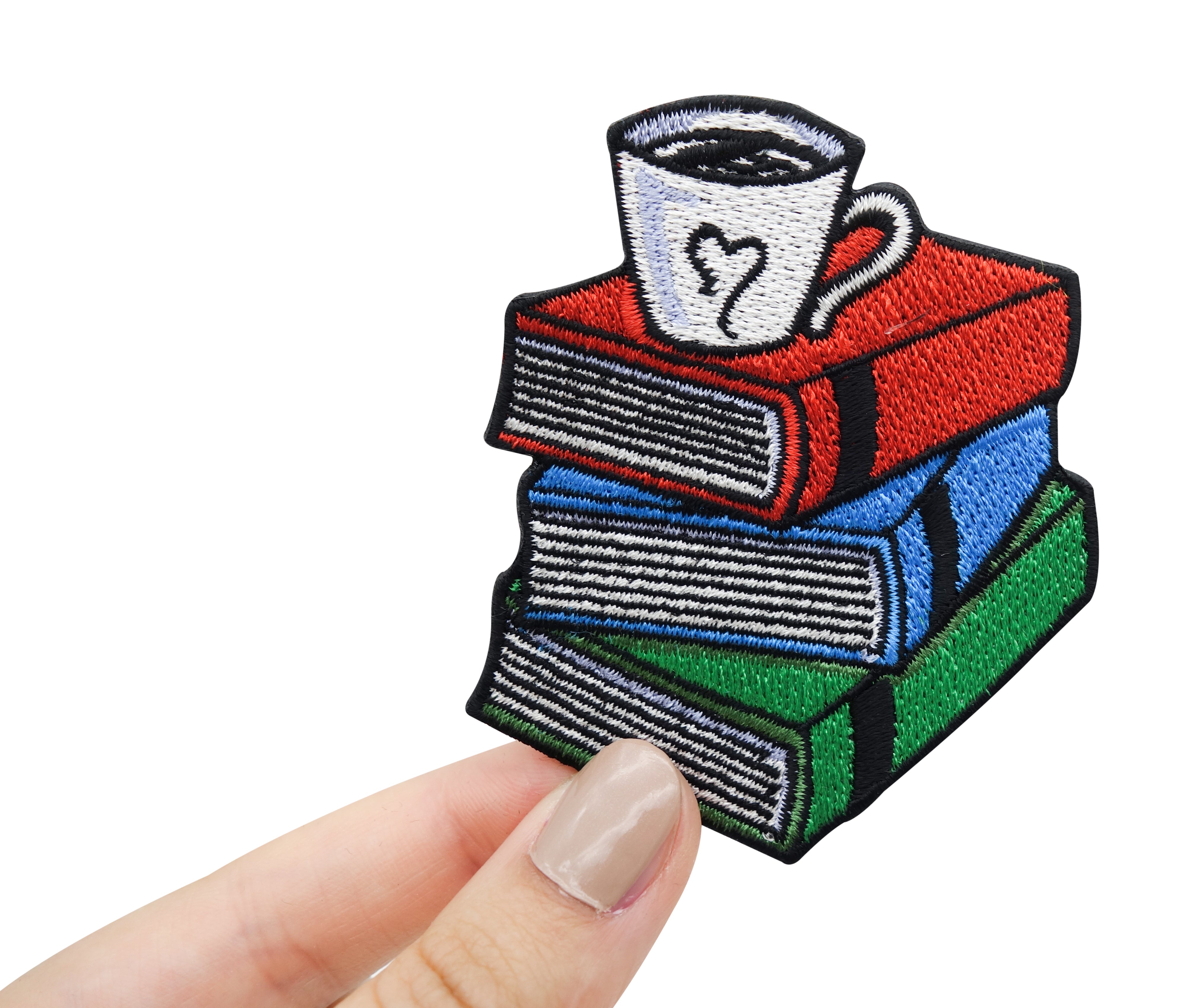 Hand hält den Bücher Patch