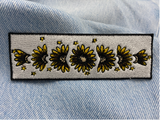 Sonnenblumen Patch auf einer blauen Jeans