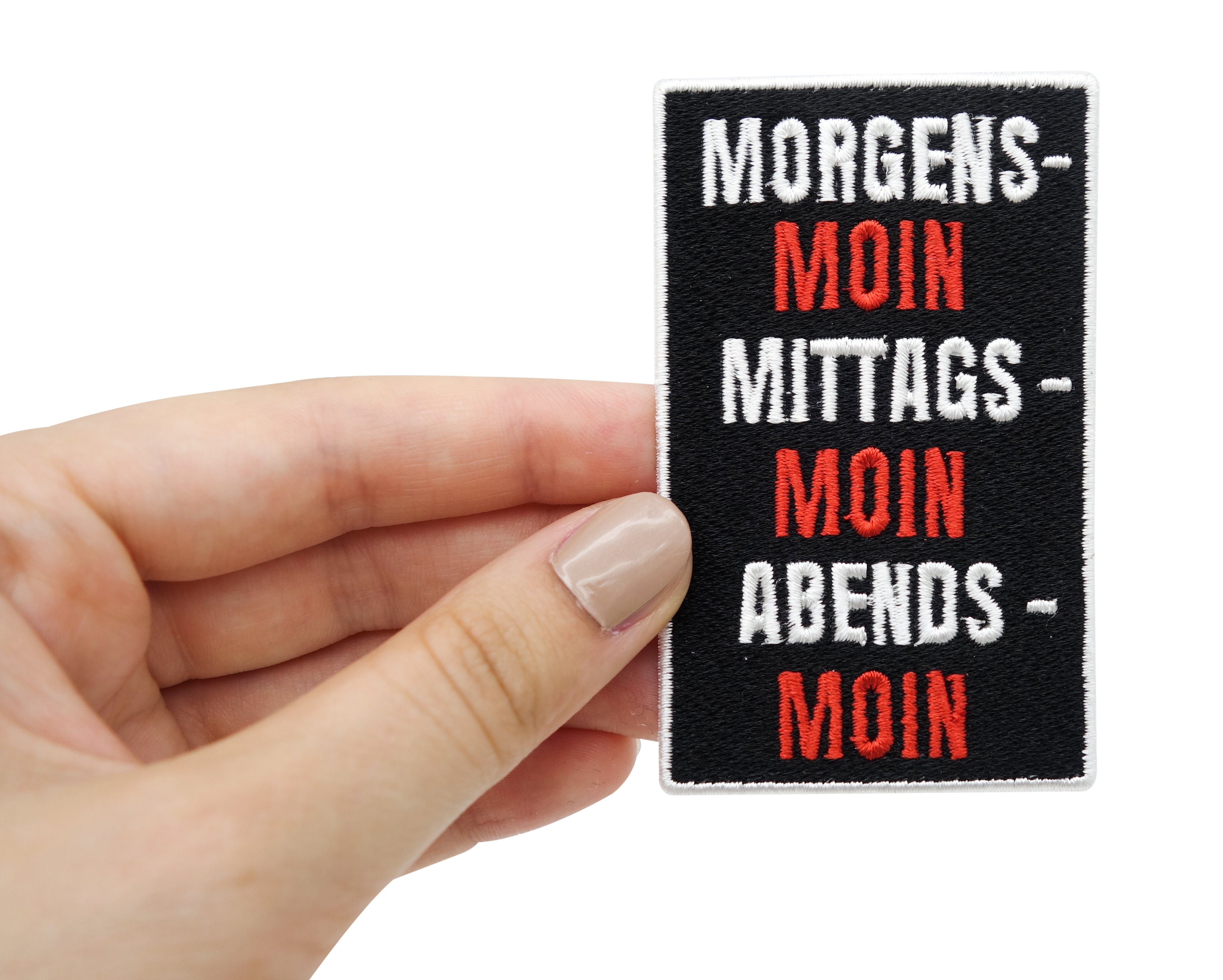 Moin Patch gehalten von einer Frauenhand