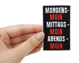 Moin Patch gehalten von einer Frauenhand