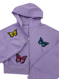 Verschieden farbige Schmetterling Patches auf violetter Jacke 