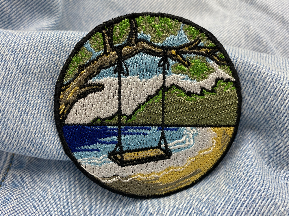 Strand Schaukel Patch auf blauer Jeans