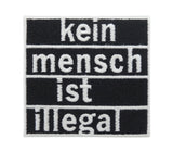 Schwarzer "Kein Mensch ist illegal" Patch