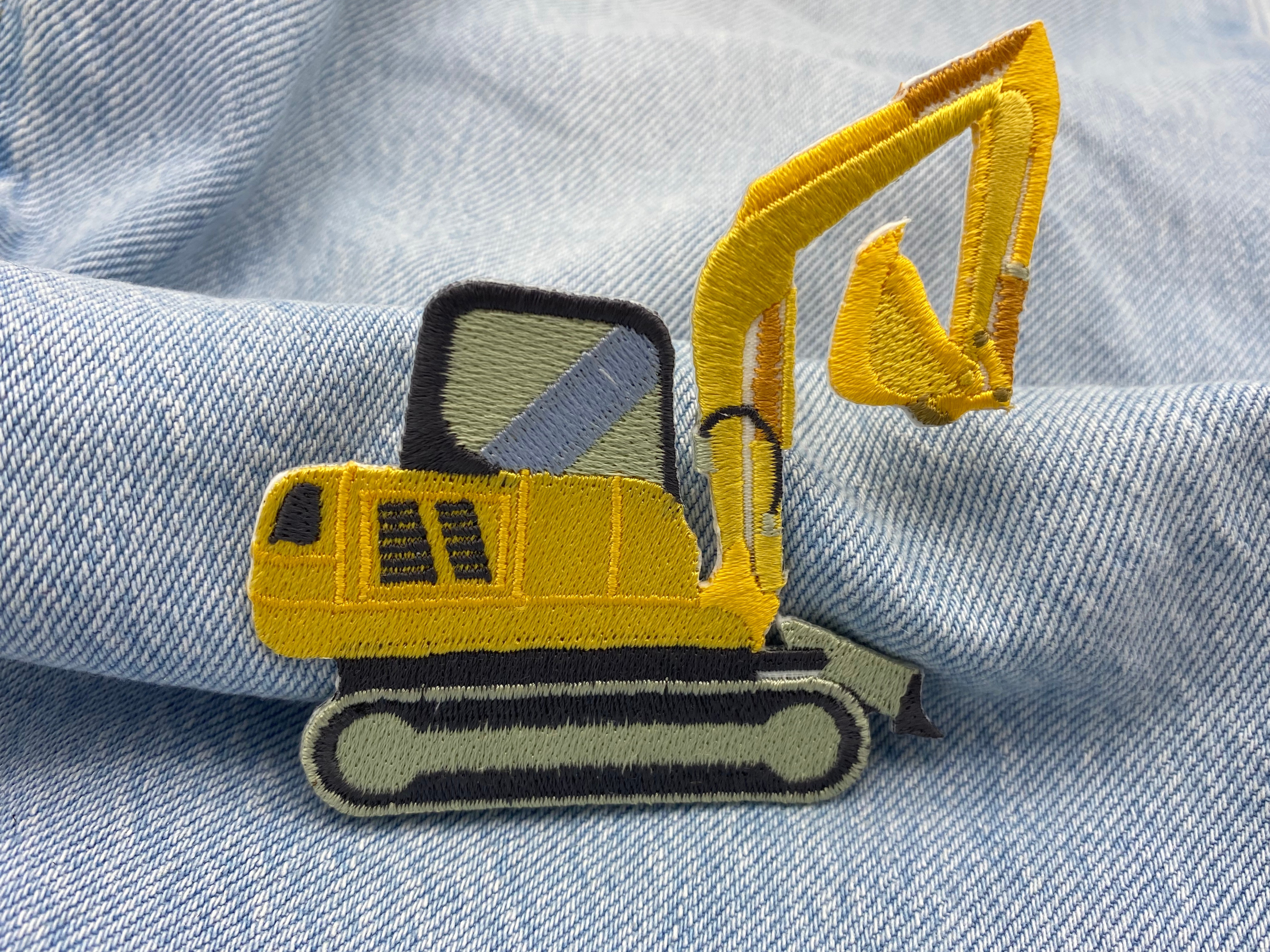 Bagger Patch auf blauer Jeans