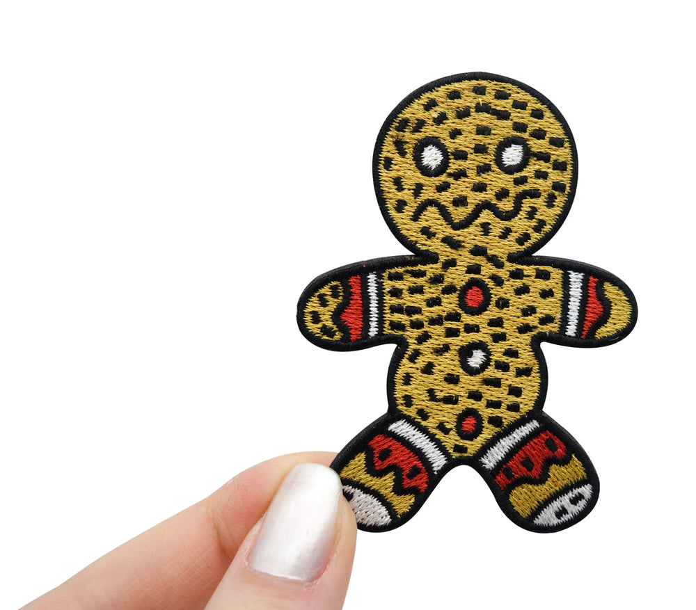 Frauenhand hält den Lebkuchenmann Patch 
