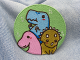 Dinosaurier Patch auf blauer Jeans