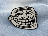 Trollface Patch auf blauer Jeans