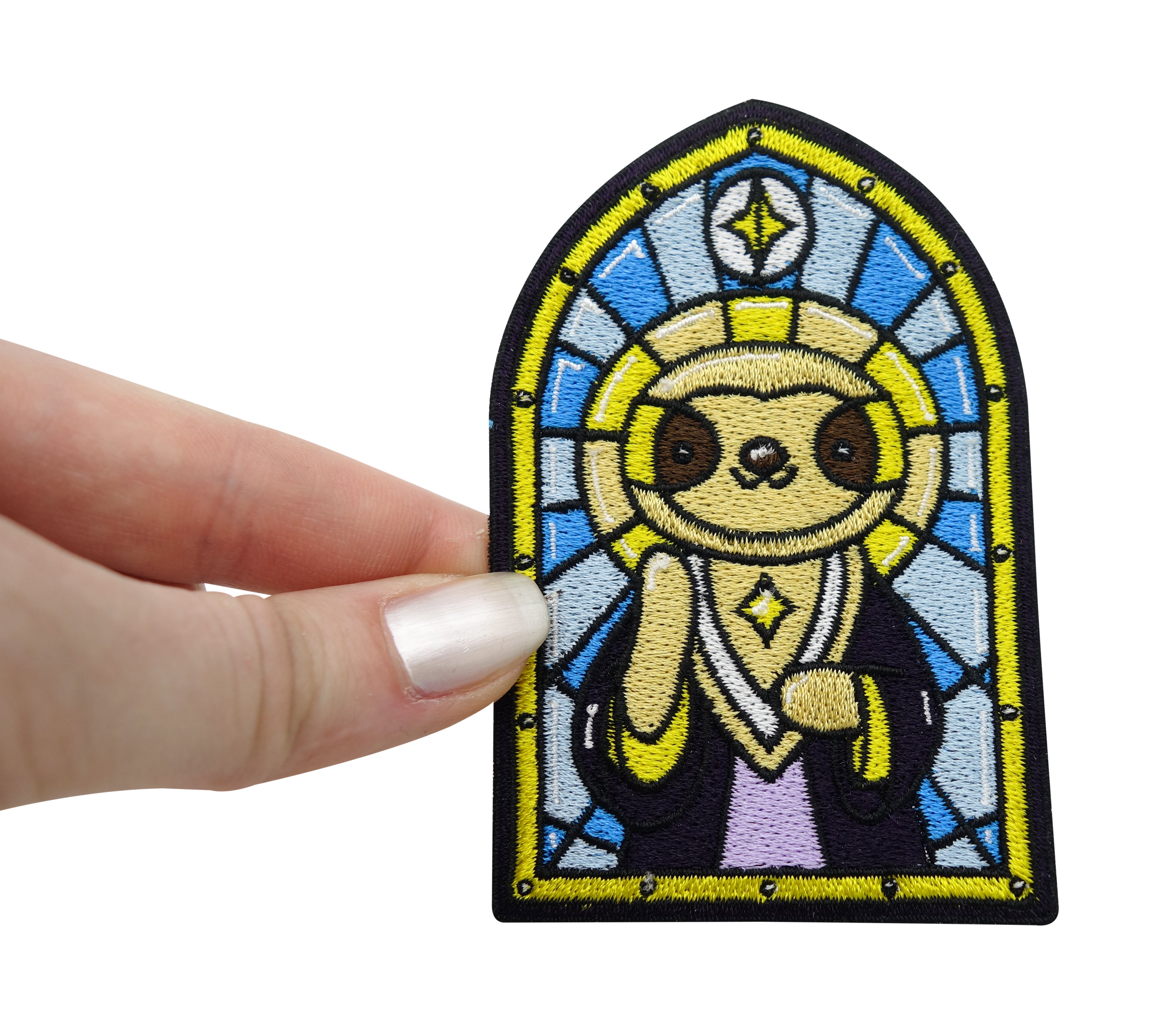 Faultier Patch gehalten von einer Frauenhand