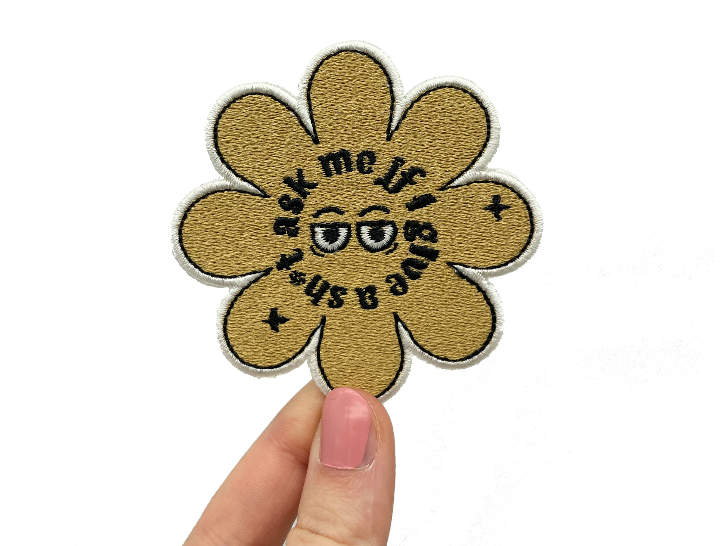 Blumen Patch gehalten von einer Frauenhand