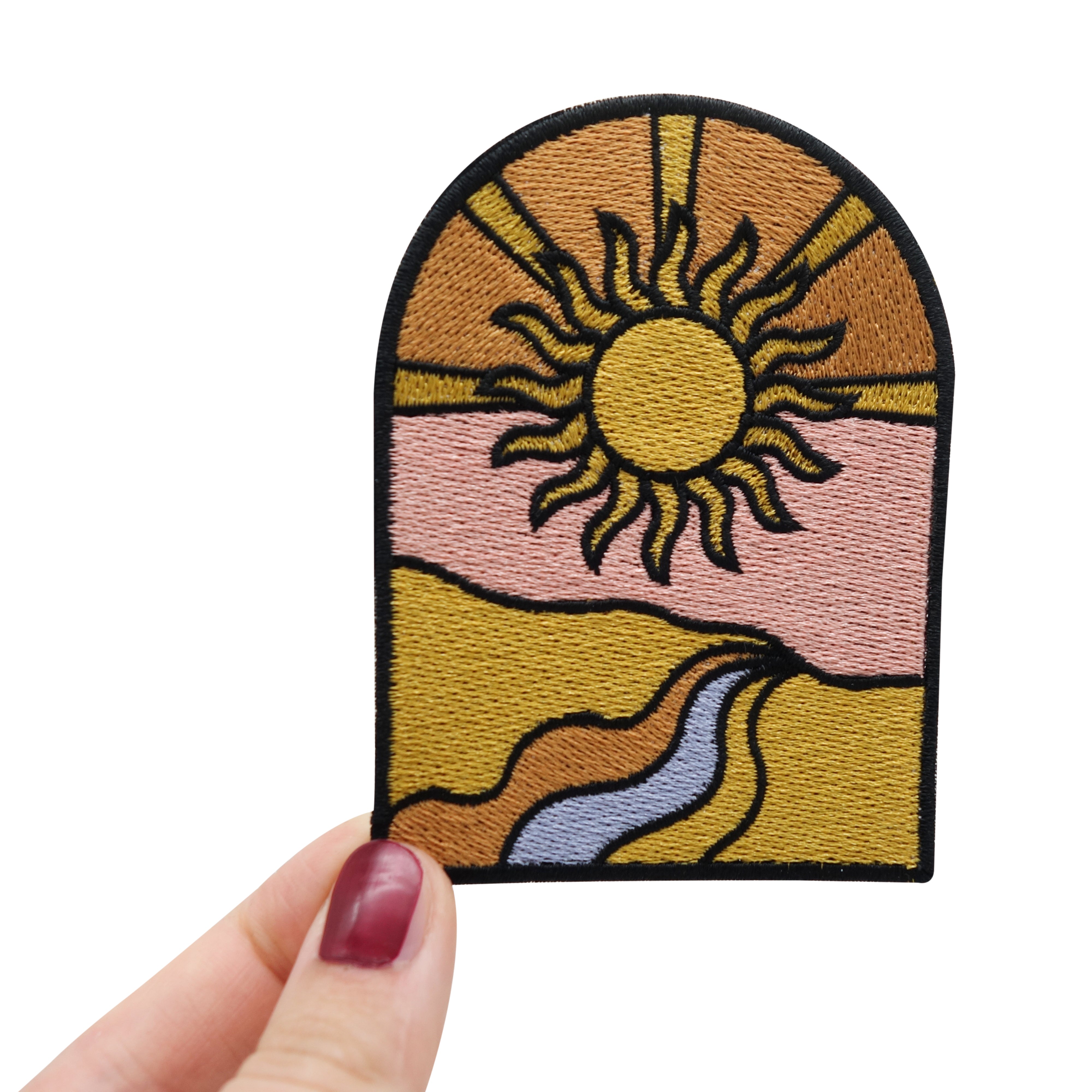 Frauenhand hält den Sonne Patch