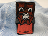 Schokolade Patch auf hellblauer Jeans